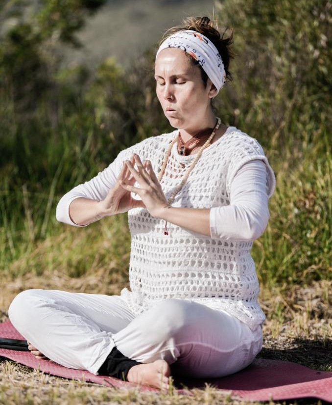 Woman doing Kundalini Yoga at Well-being sanctuary